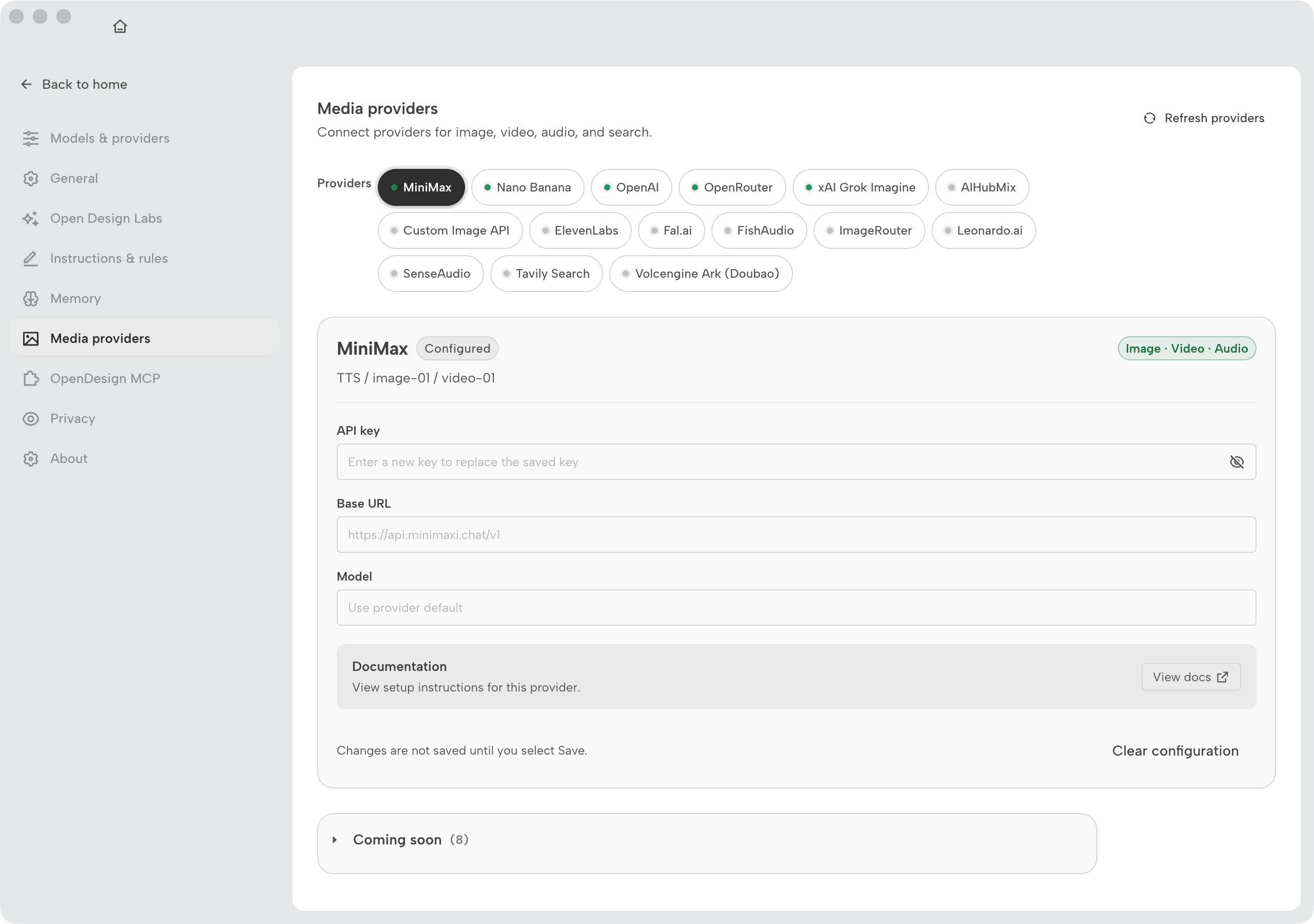 OpenDesign Workspace settings Media providers page with configured and unconfigured provider chips and a MiniMax configuration card with masked API key field